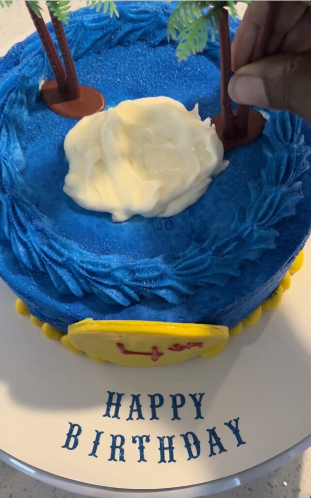 Yellow Fondant on a blue cake